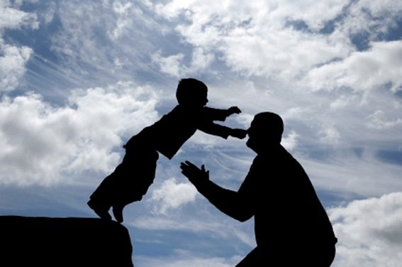 A man and child are playing together in the sky.